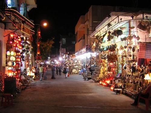 a night time view of the calm town centres of hurghada with everyday shops